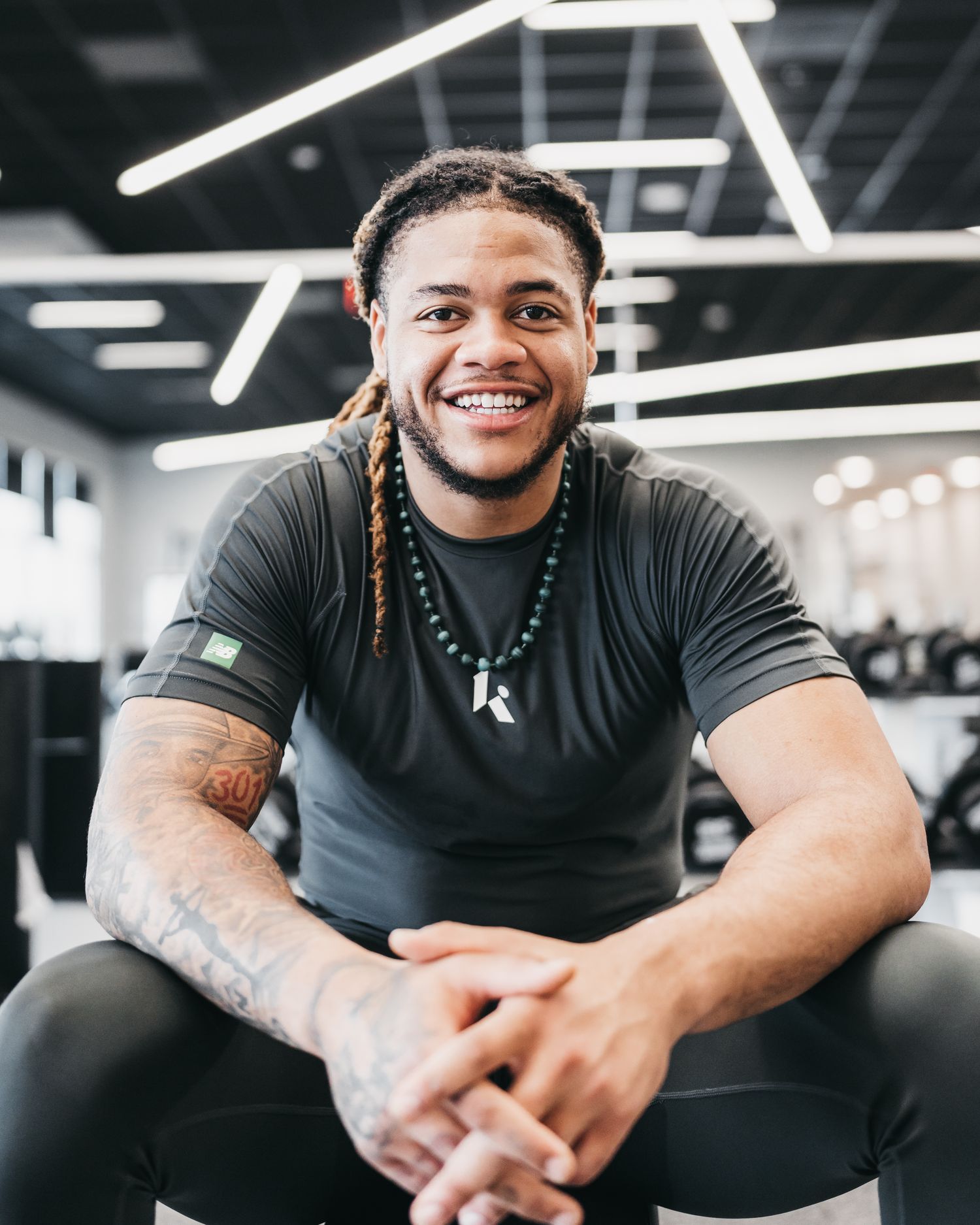 Chase Young smiles for a photo shoot.